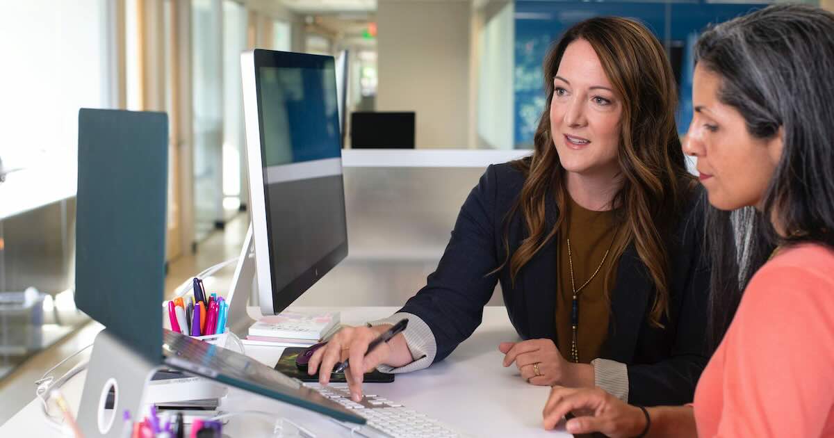 Business women reviewing data