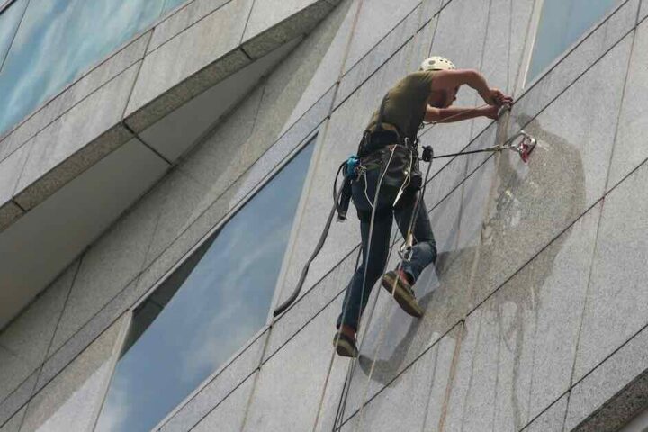Window cleaner on a harness