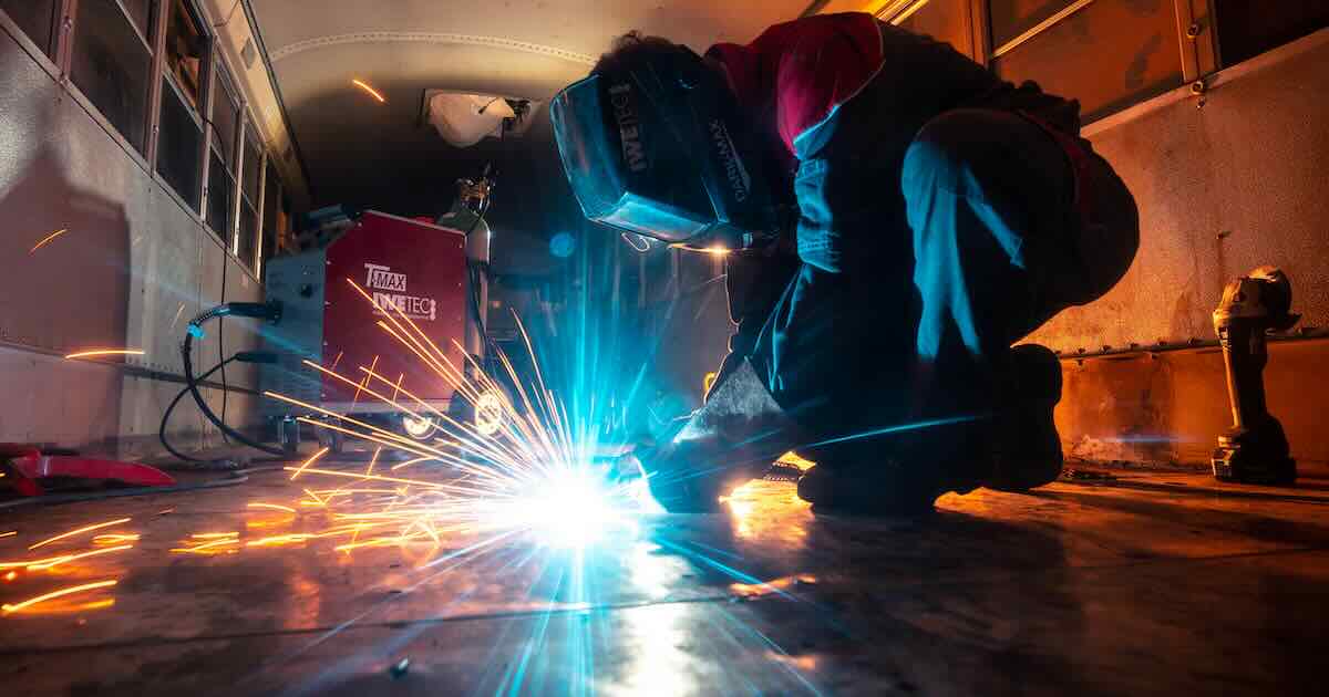 welder in industrial setting